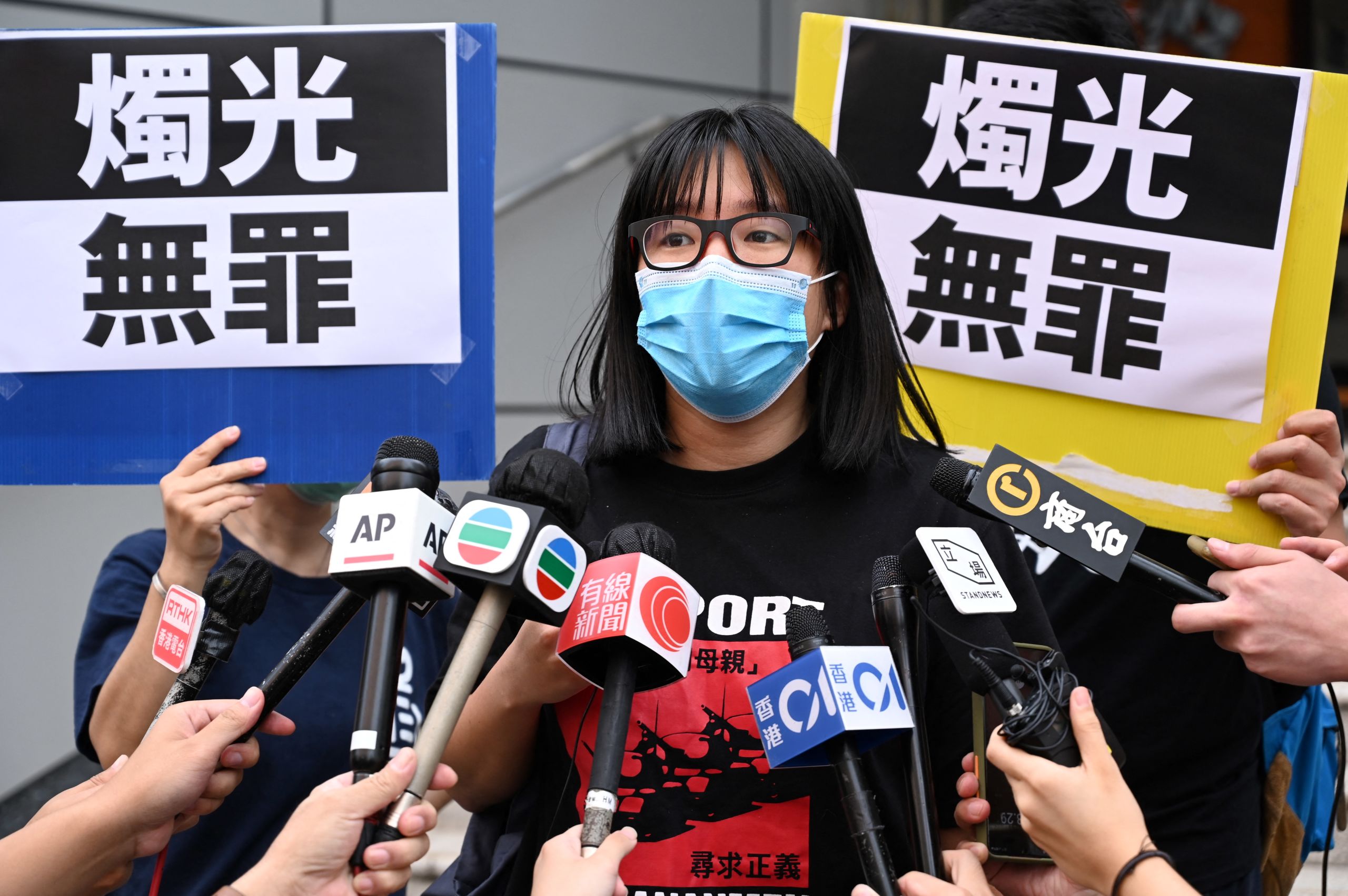 Political activist Chow Hang-tung speaks to the media after leaving Tsuen Wan police station a day after being arrested in Hong Kong on June 5, 2021.