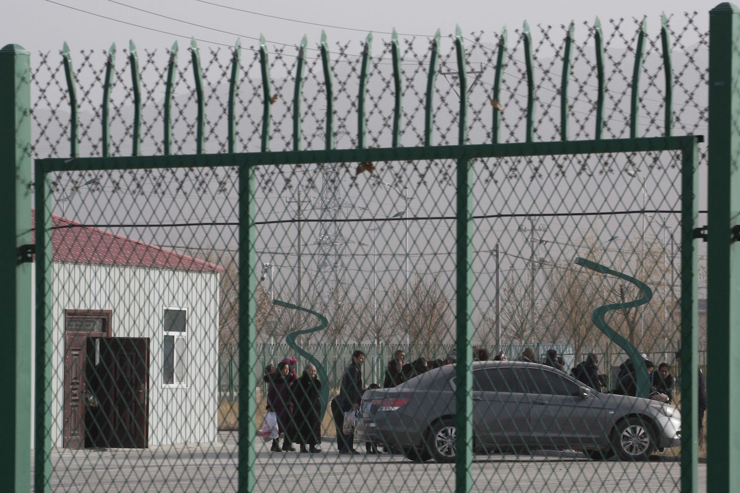 Residents line up inside the Artux City Vocational Skills Education Training Service Center which has previously been revealed by leaked documents to be a "re-education camp" camp in Xinjiang. (AP / Ng Han Guan)