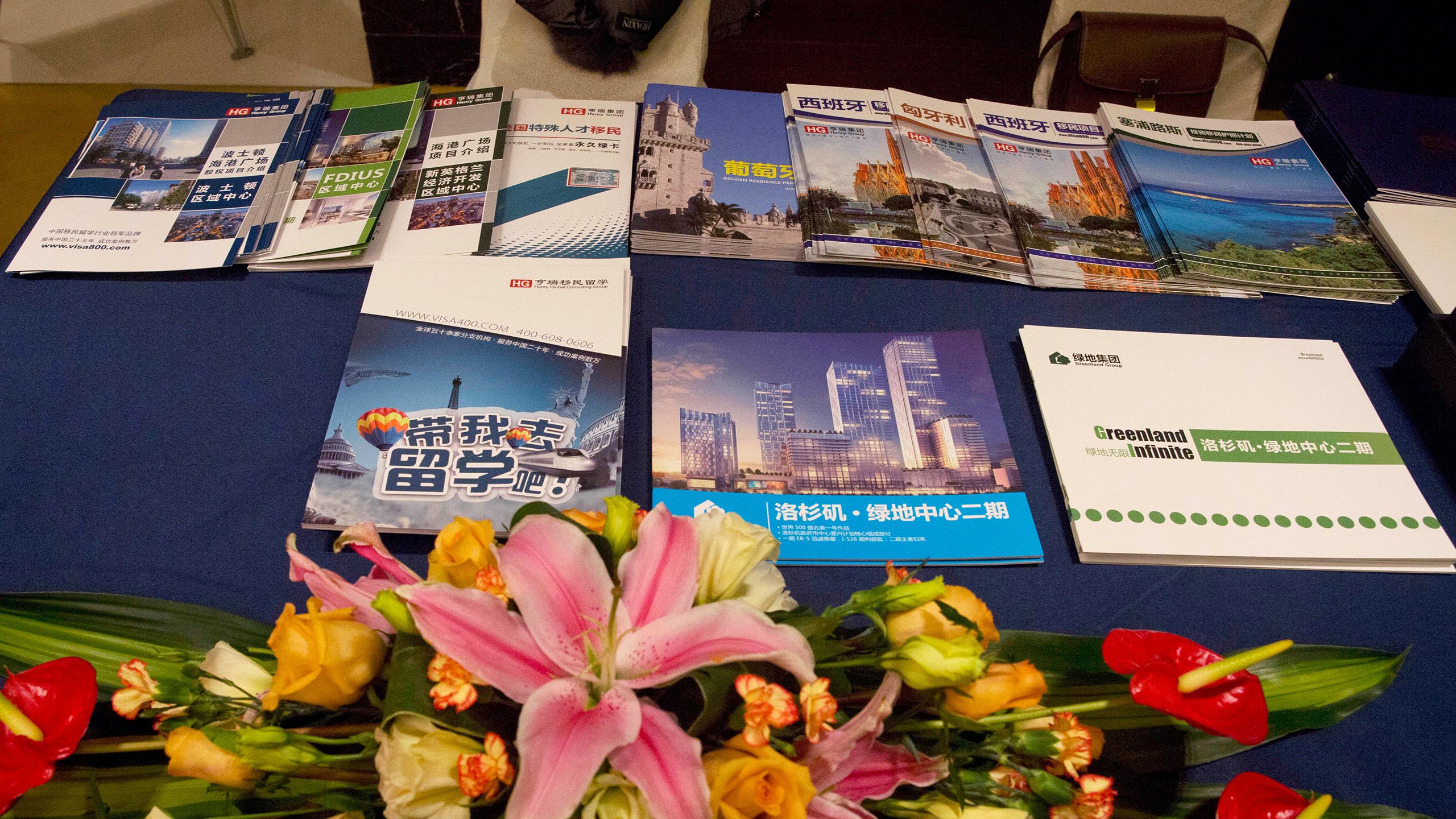 Various immigration information pamphlets seen at an immigration exhibition. (AP / Ng Han Guan)