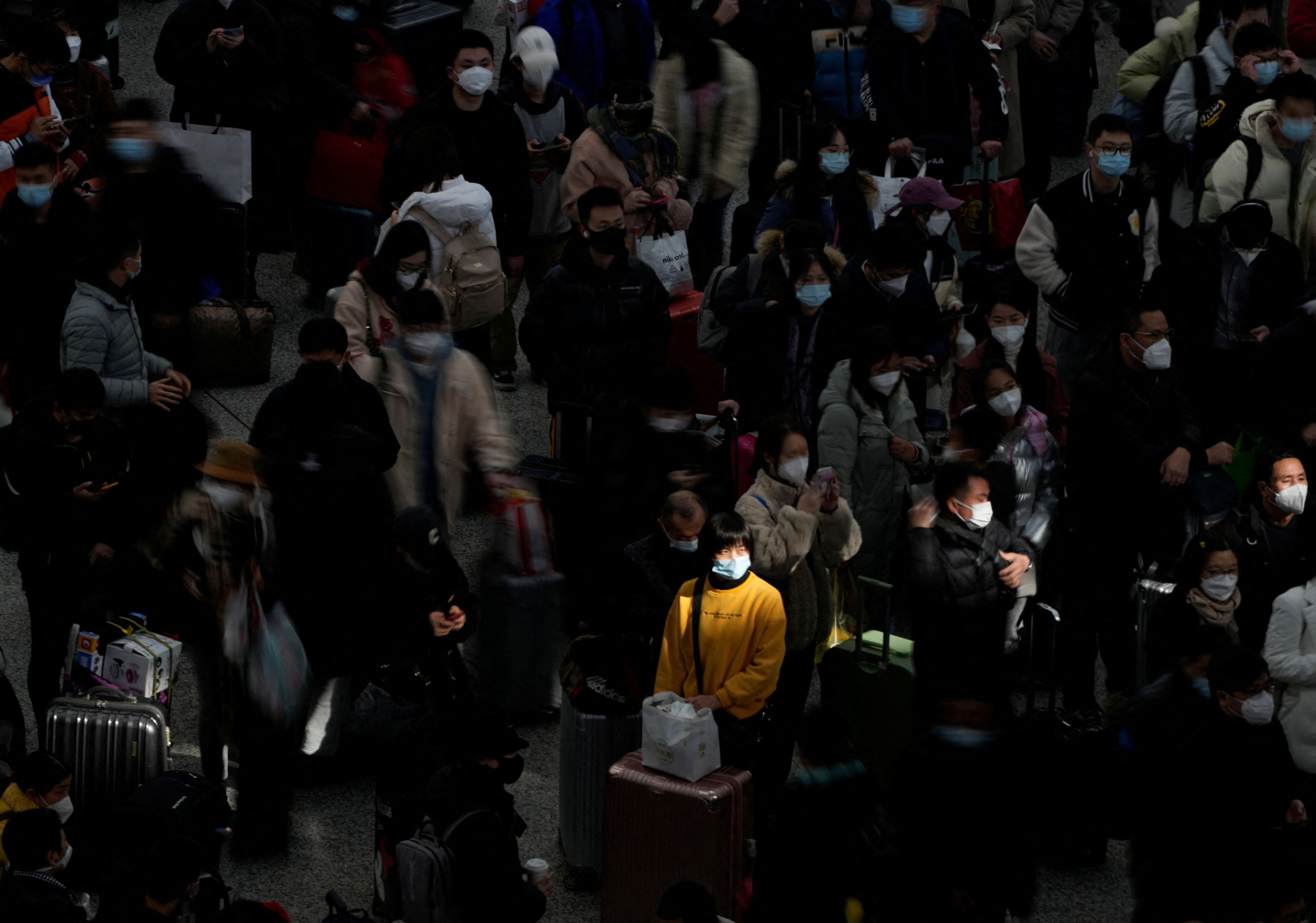 Passengers wait to board trains at Shanghai's Hongqiao Railway Station during the annual Spring Festival travel rush ahead of the Chinese Lunar New Year on Jan 18, 2023. (Reuters / Aly Song)