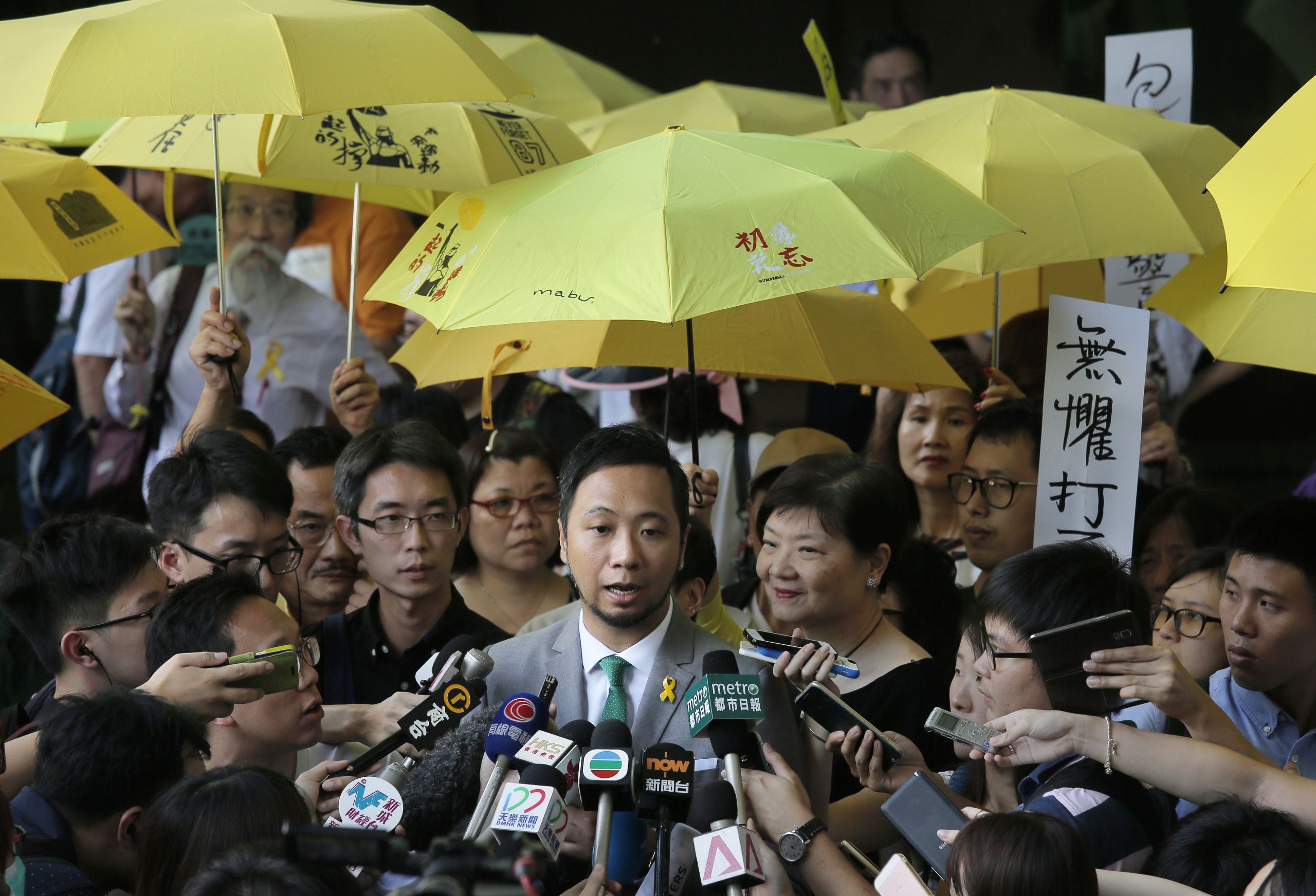 Victim of the Seven Dark Corners incident, Tsang Kin-chiu, who was physically assaulted by the seven policemen for four minutes, was found guilty of three counts and sentenced to jail. (AP) 