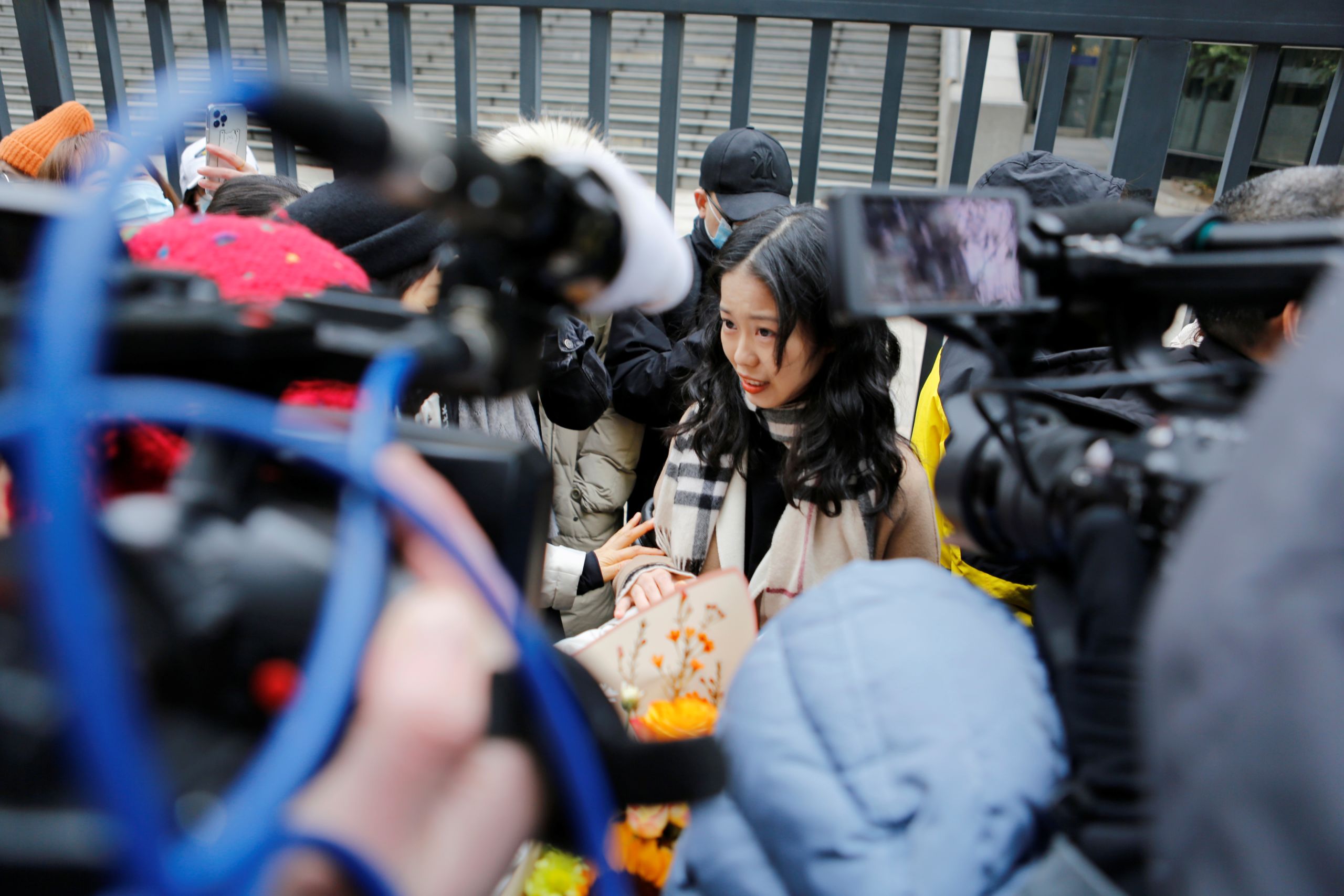 December 2020, Xianzi head to court surrounded by reporters and supporters alike. (Source: Reuters)